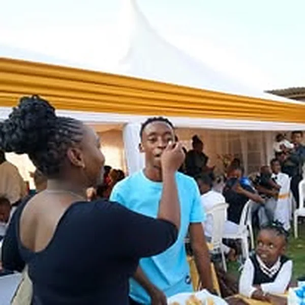 Guests enjoying cake at a celebration