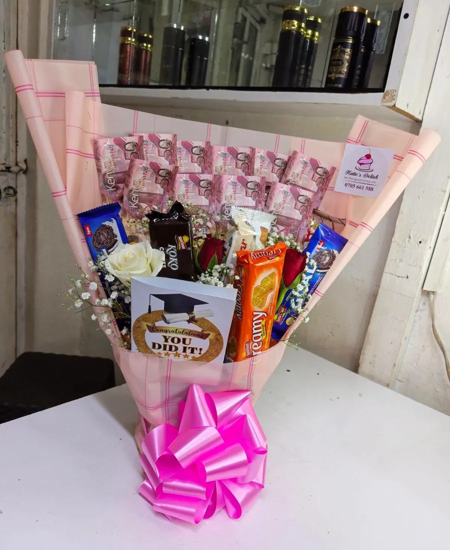 Money and treats surprise bouquet wrapped in pink